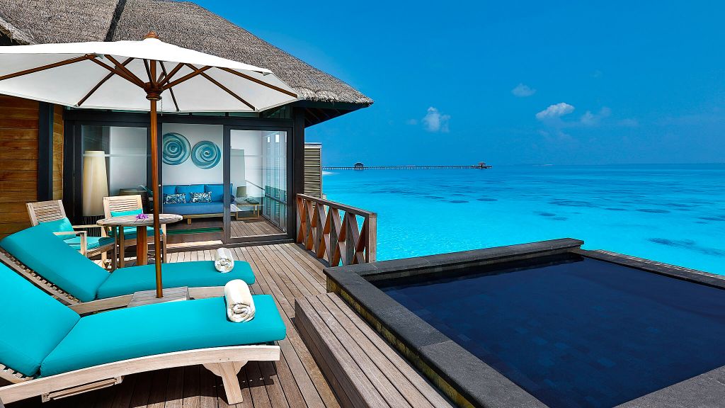 JA Manafaru Island bungalow with sunbeds and private pool