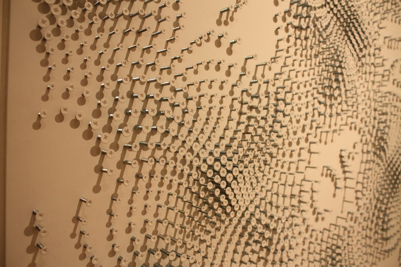 Tanner precisely places all the screws to fashion the impressive pieces.