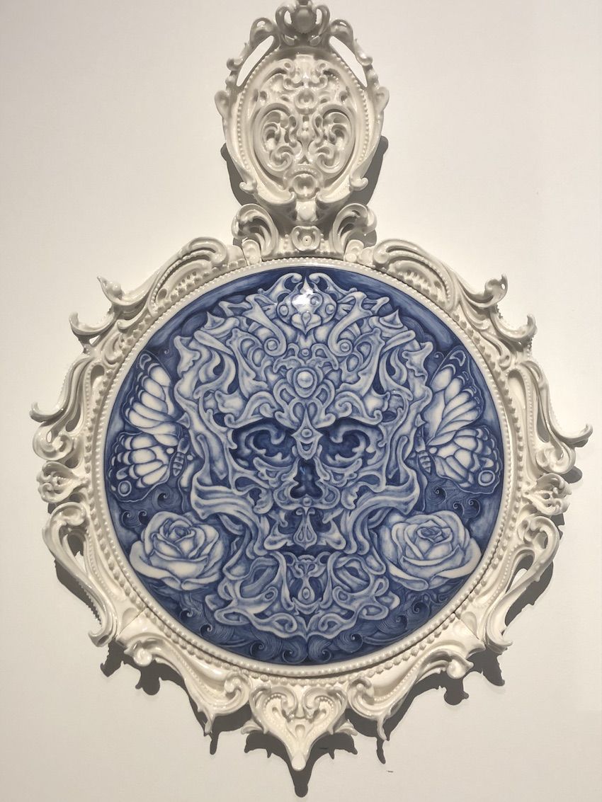 The mix of rococo elements and the trippy central design come together in a marvelous porcelain work.