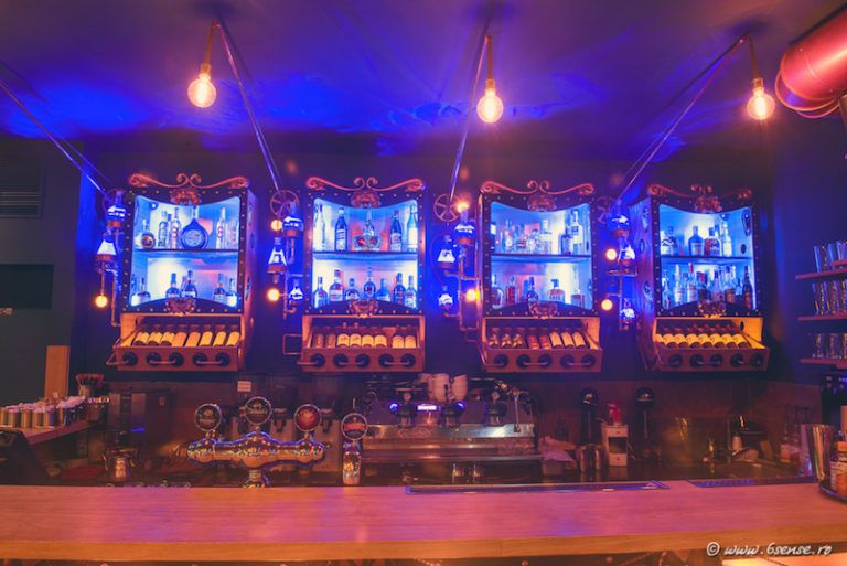 The bar front is decorated with cog wheels, chains and lights