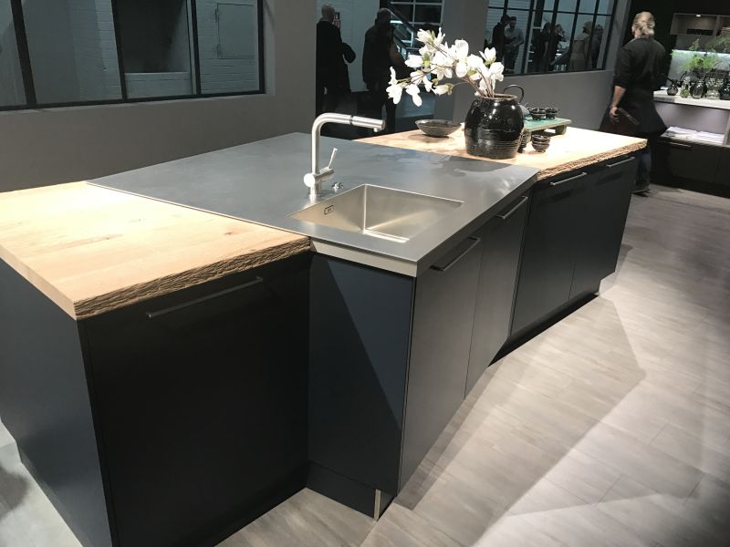 Kitchen island with wood and stainless steel from haecker kuechen