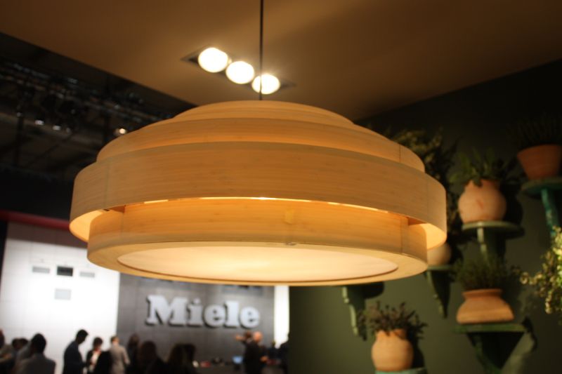 For a more natural look, Ilve incorporated this kitchen pendant light fixture made of concentric circles of wooden bands.