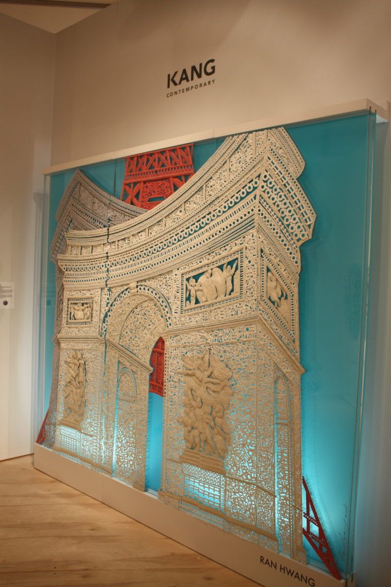 This is composed of paper Hangul Buttons, Pins, and beads on plexiglass.