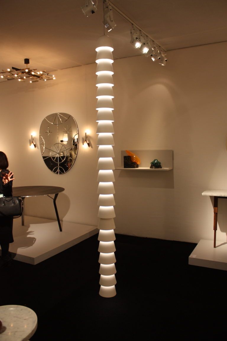 The long, slender fixture dominates the space without overwhelming.