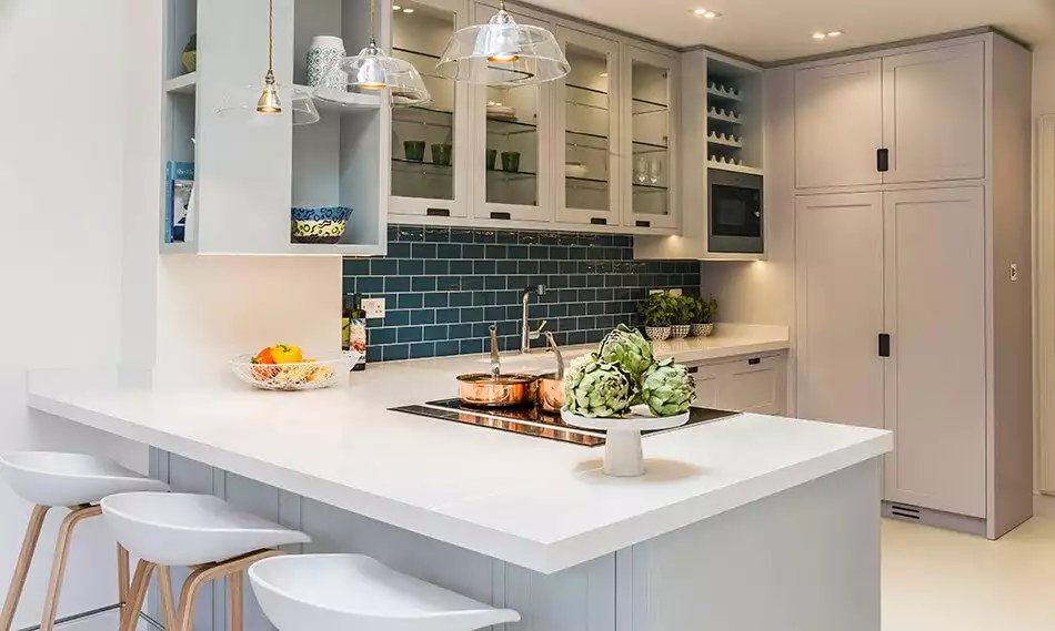 L shaped kitchen design with colorful subway tiles