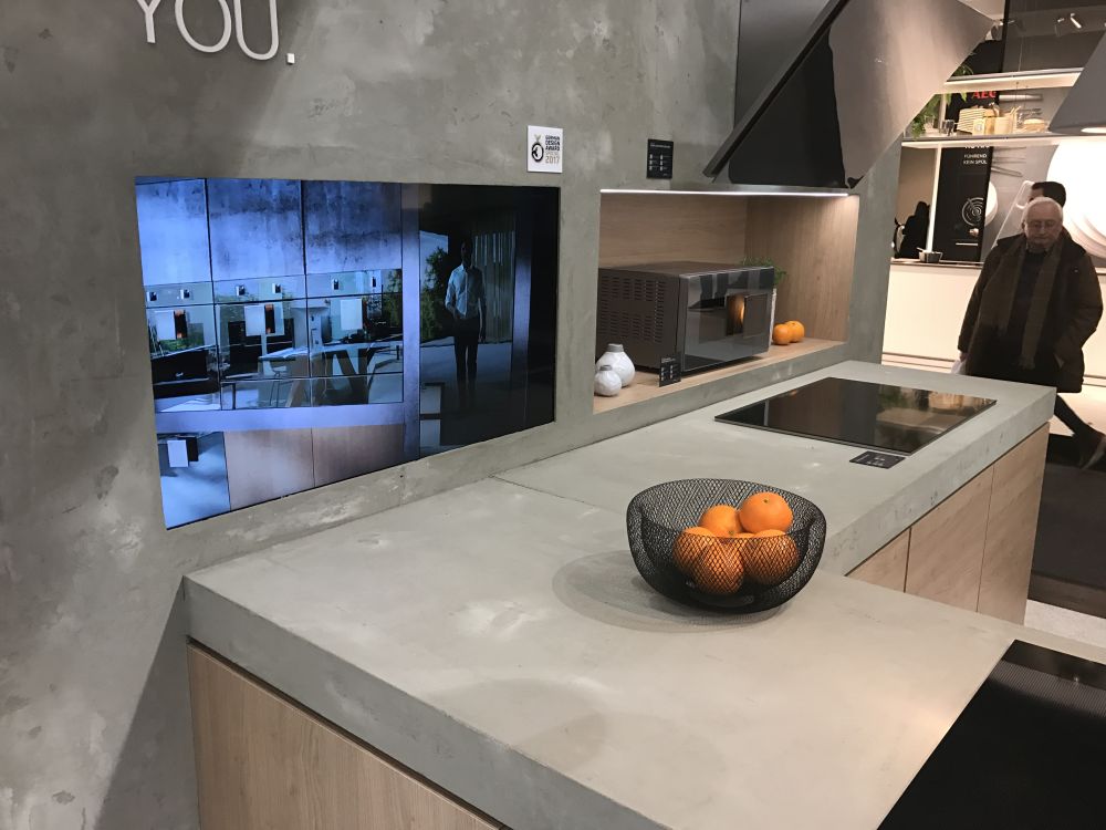 L shaped kitchen with cement countertop