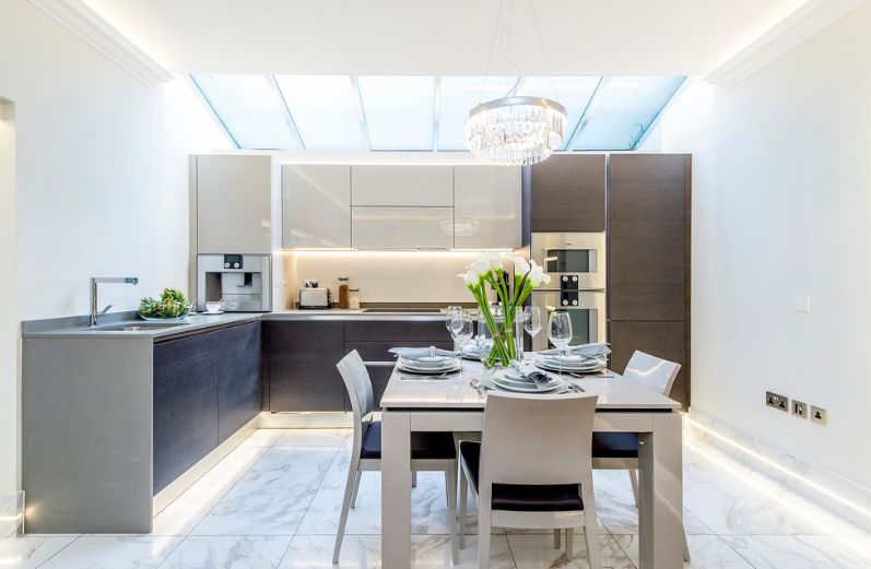 L shaped kitchen with clean marble floor