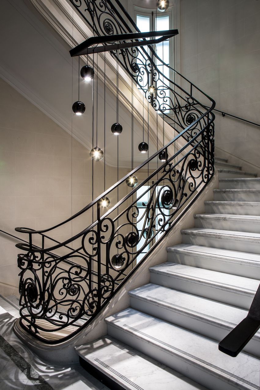 La Clef Cozy Paris Hotel - staircase and pendant lamp