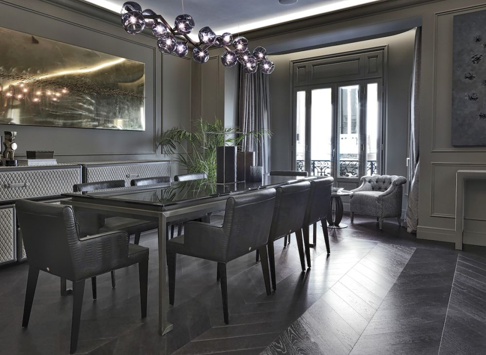 A stunning suspension light accents the dining table and area.