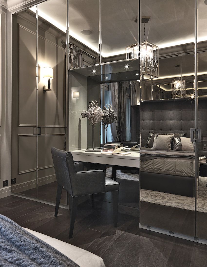 Mirrored closets make the room feel even larger.