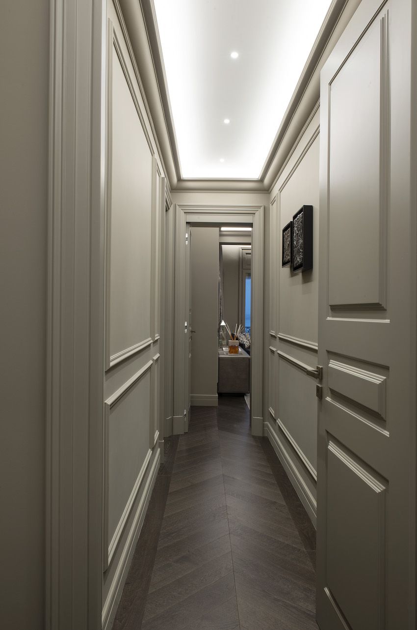 A minimum of art maintains the clean lines of the hallway.