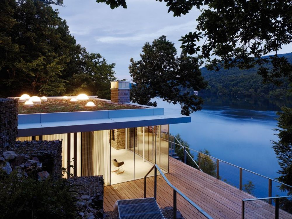 Lake House Prefab with green roof and waterfront by LHVH Architekten