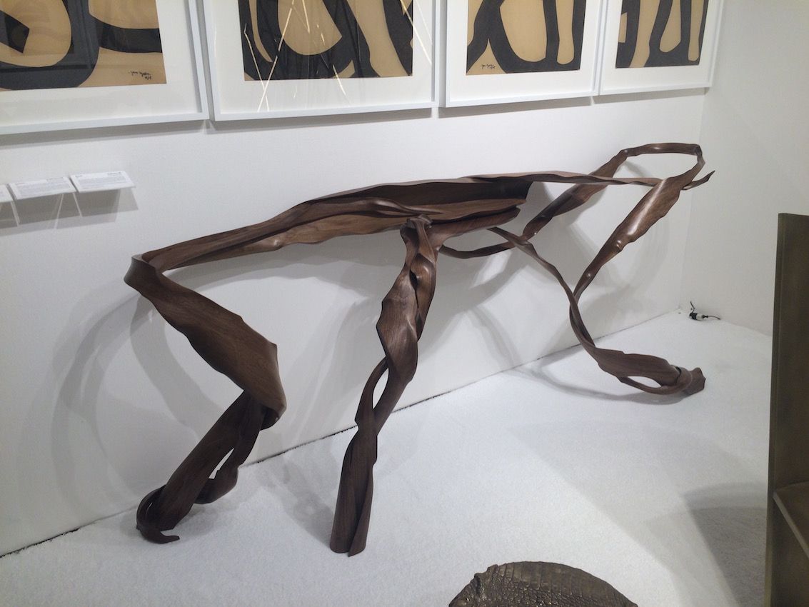 This sculptural console by Fish is called Laminar and uses almost 400 pieces of American Black Walnut veneer. It is said to be inspired by marine life, although some people also see the image of a crawling man when they look at it.