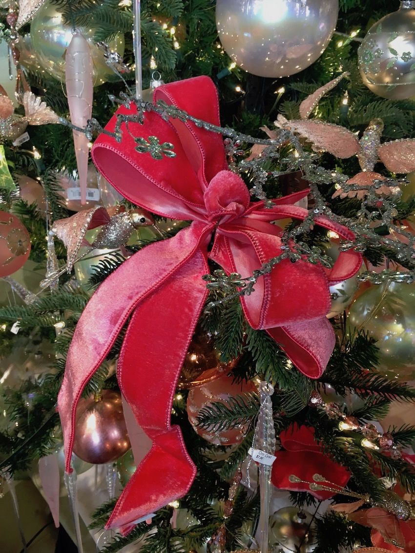 Velvet bows add a bit of shine and a lot of texture to a very shiny tree.