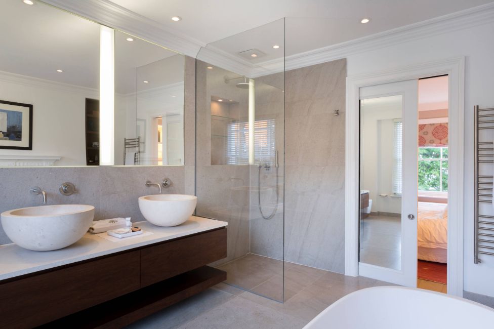 Large bathroom with walk in shower and over the door mirror -sliding pocket