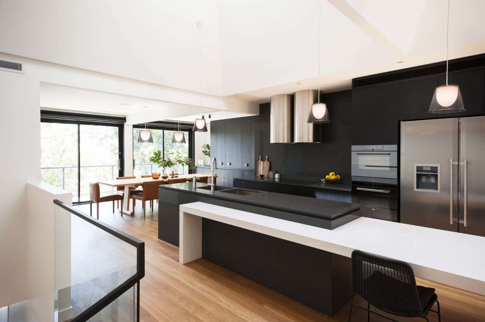 Large black kitchen with white island