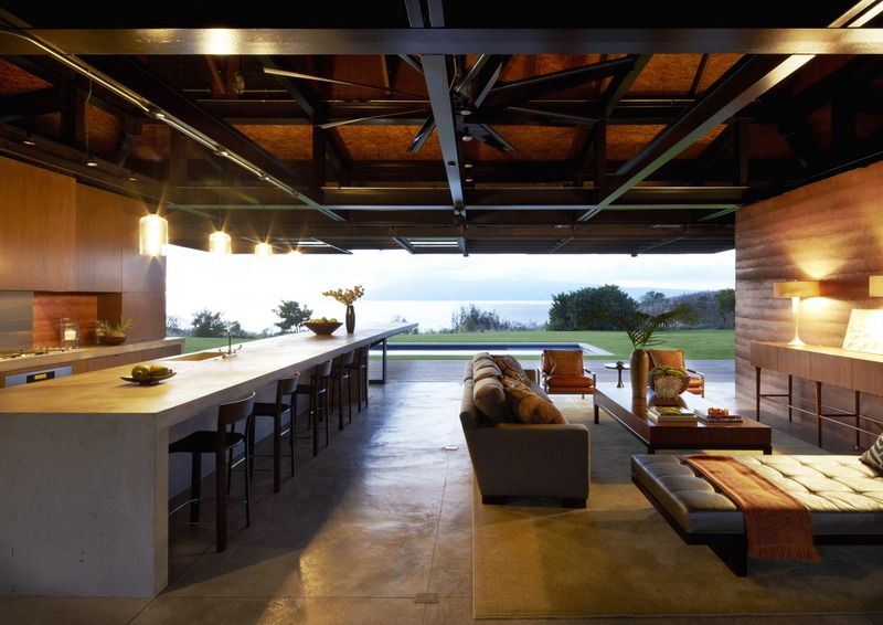 Large concrete kitchen island with seating