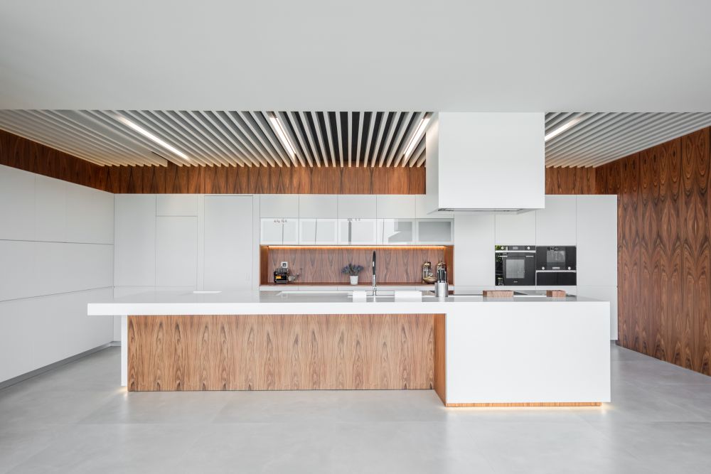 Large kitchen with island doubling the space