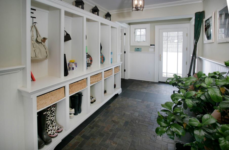 Large mudroom organization with wicker baskets