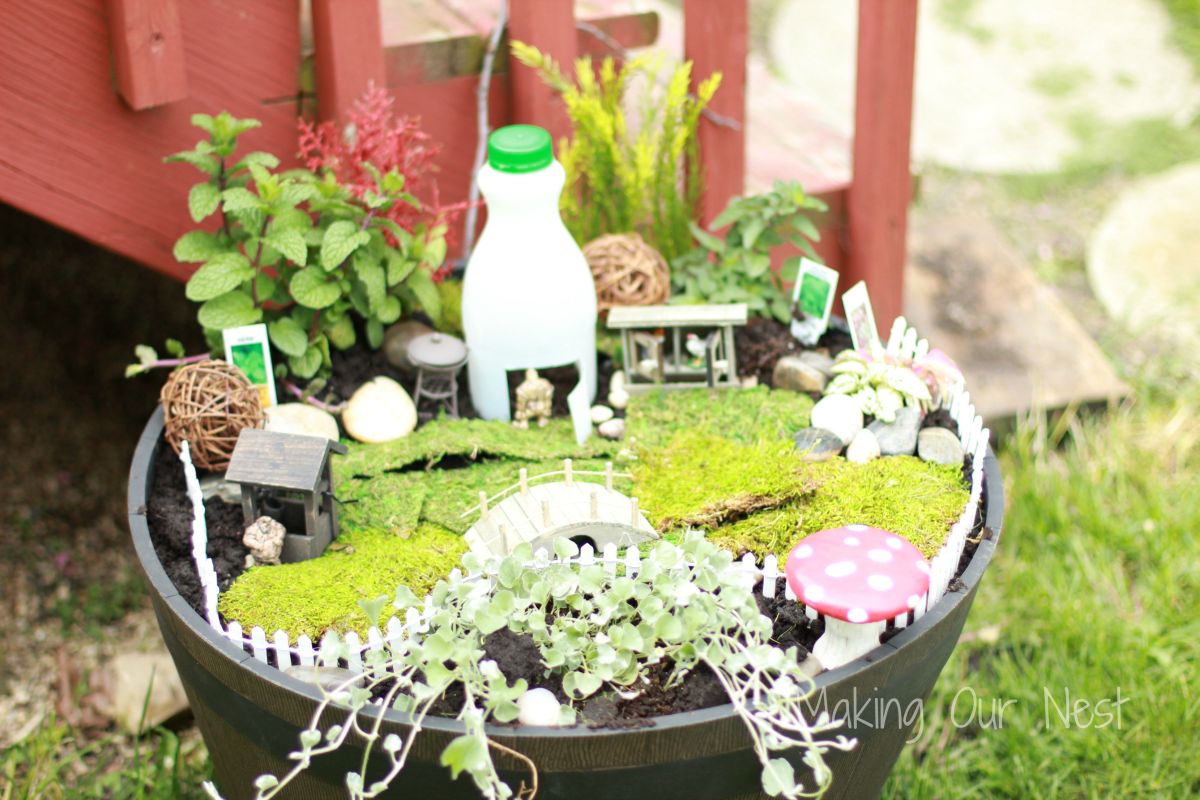 Large planter bucket into a fairy garden