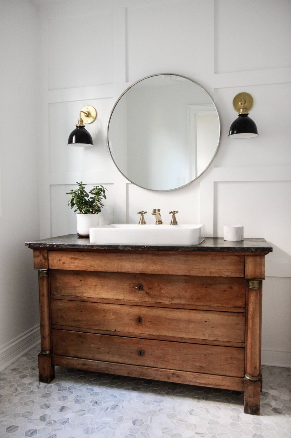 Large round mirror with a vintage vanity