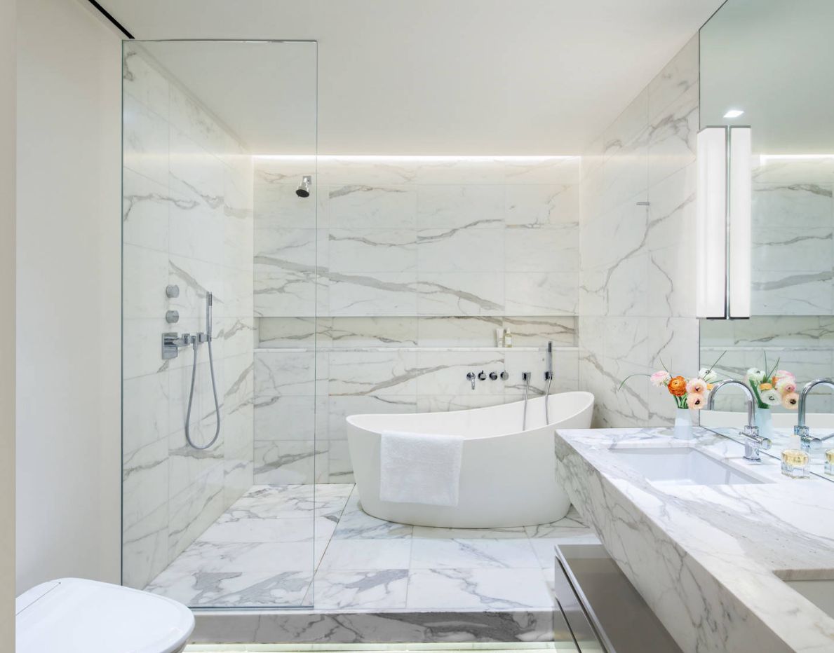 Large walk in bathroom decor with marble accents