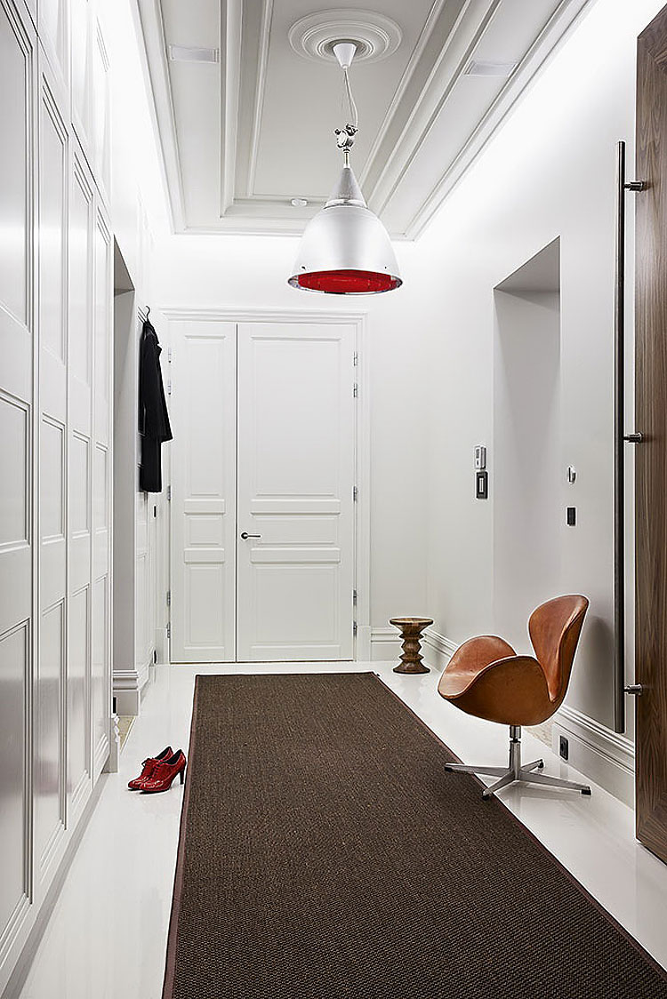 Large white entryway with a small egg leather chair