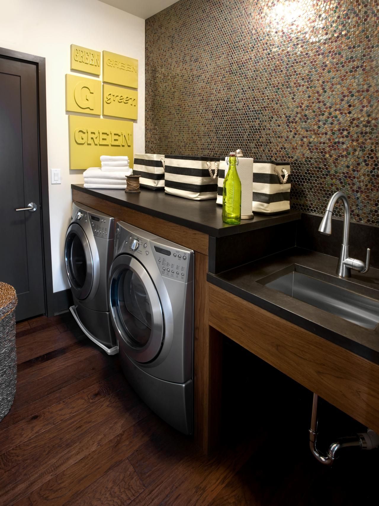 Laundry room with a dark penny wall design