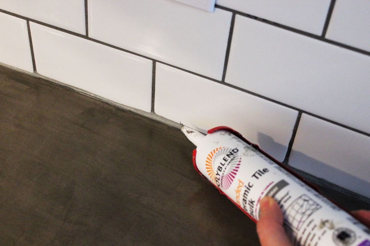 Lay a thin strip of caulk along