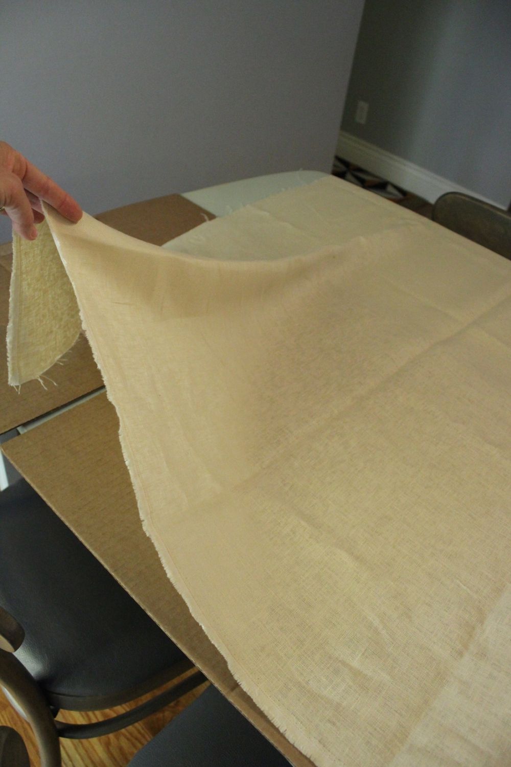 Lay your fabric over the cardboard