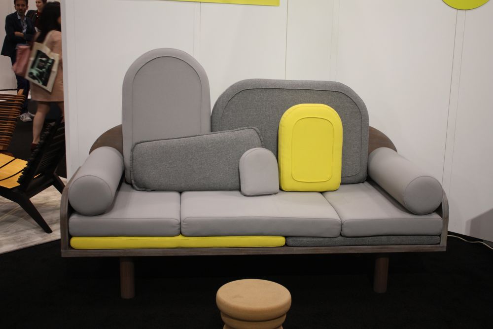 LePointed couch in gray with yellow accents