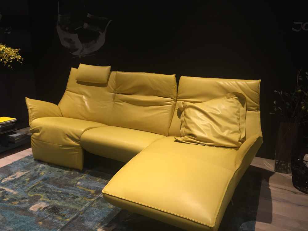 Leather yellow couch with black decor