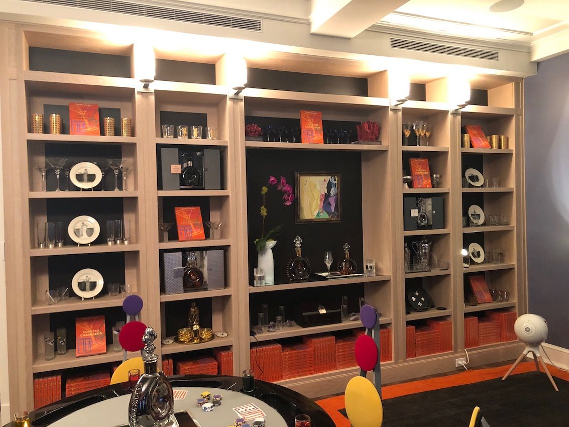 A wall of shelving in a room meant for fun is ideal for displaying objects with a theme.