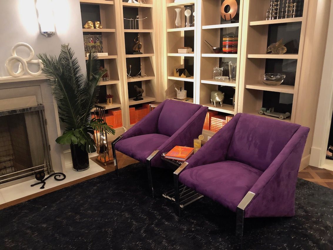 A small conversation area in the game room lets guests step away from the action for a chat.