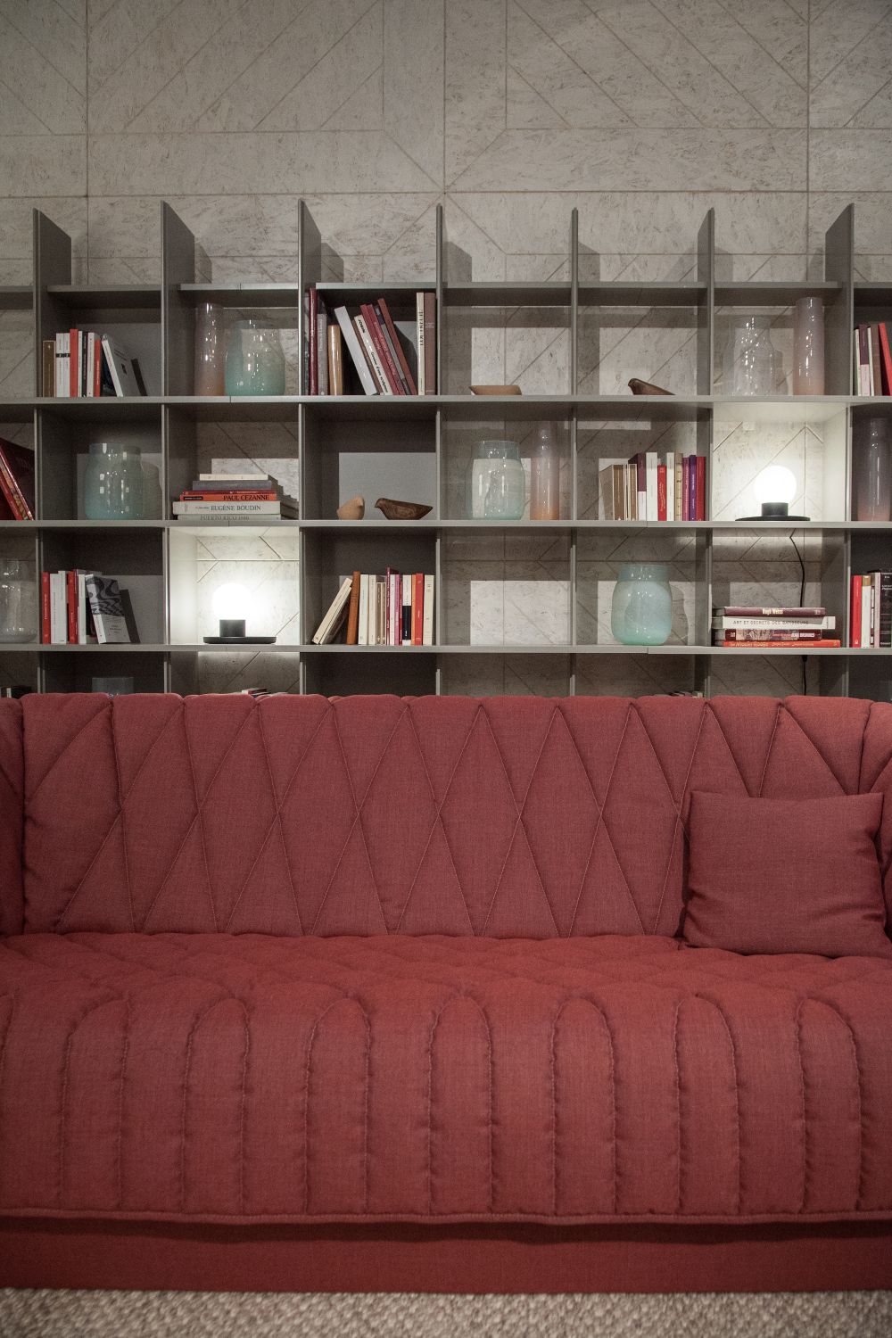 Library wall behind the sofa made from shelves