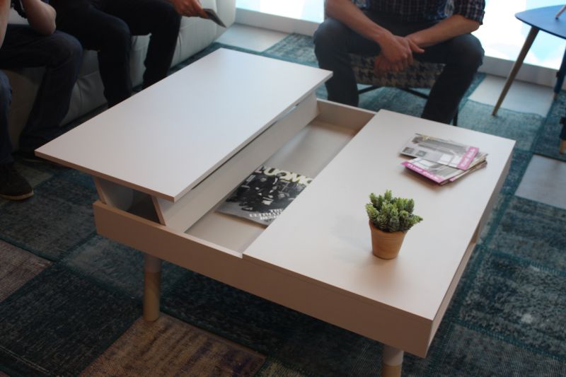 Pedro Ortiz also has this square coffee table with sides that rise up to the side, providing a surface that's more convenient for eating or for work.