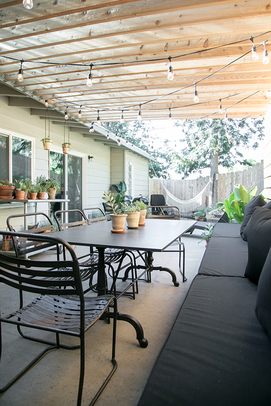 decorate your pergola with larger bulb string lights