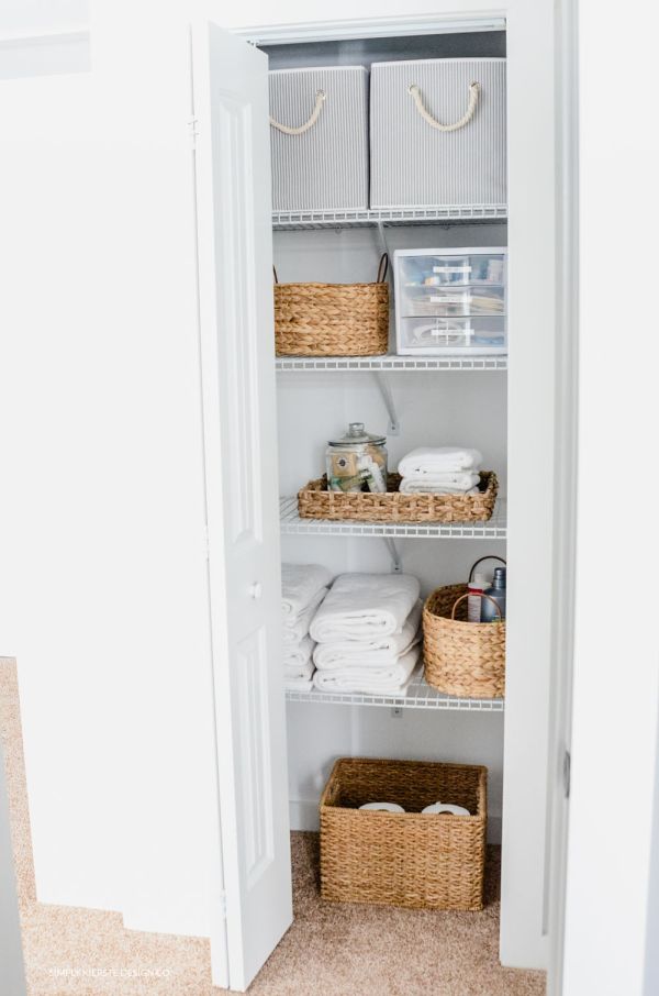 Linen closet makeover featuring baskets