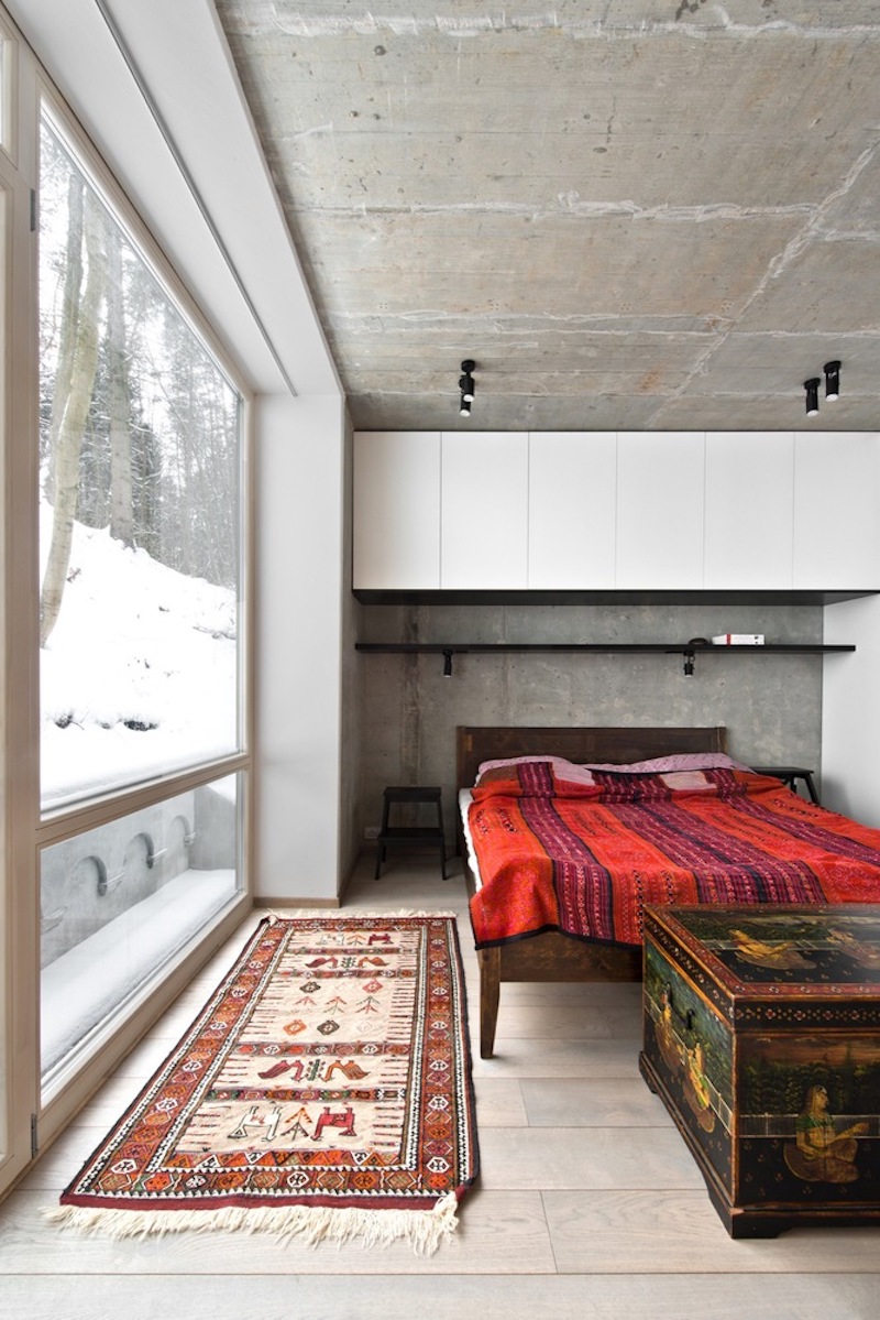 The bedrooms are quite interesting because they feature exposed concrete walls and ceilings