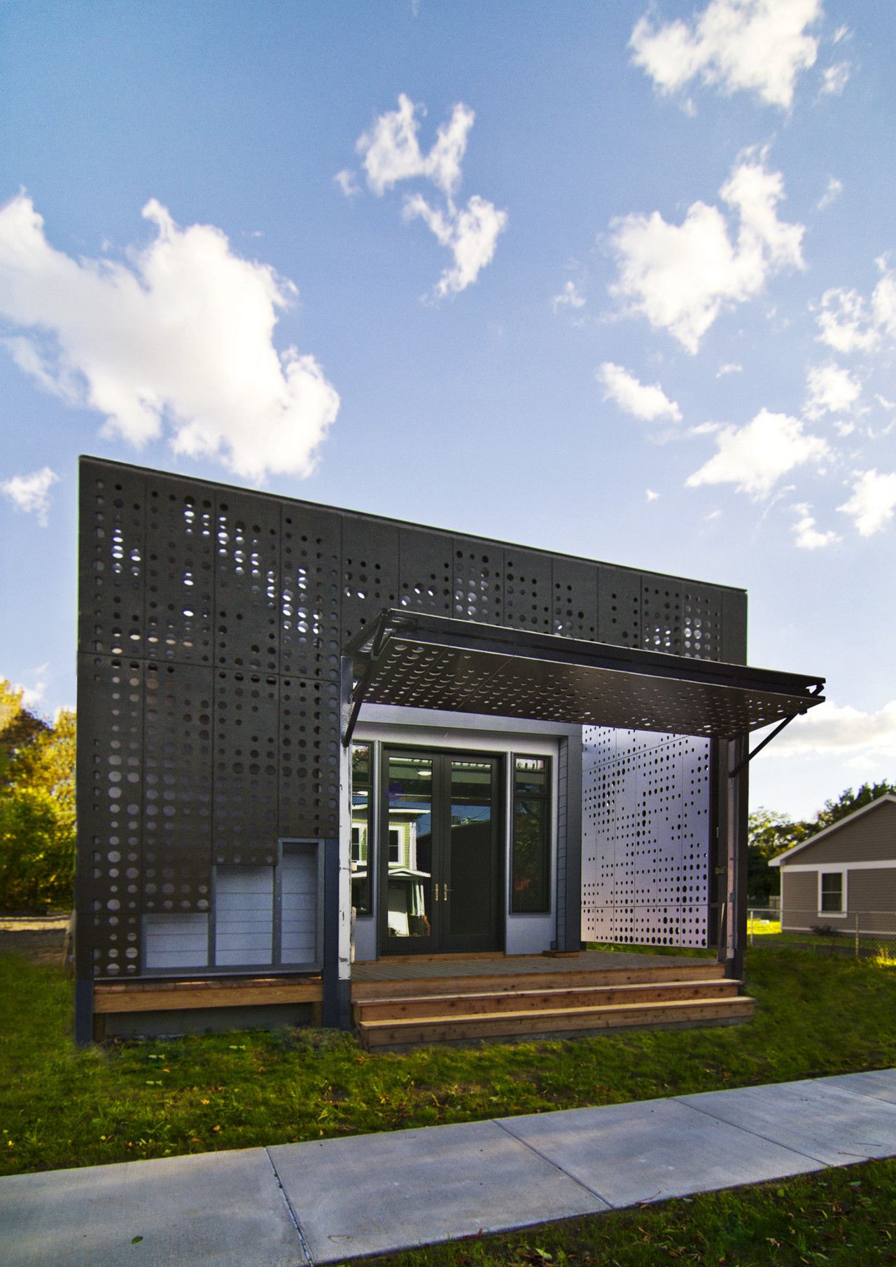 Live Work Home with a perforated Facade open