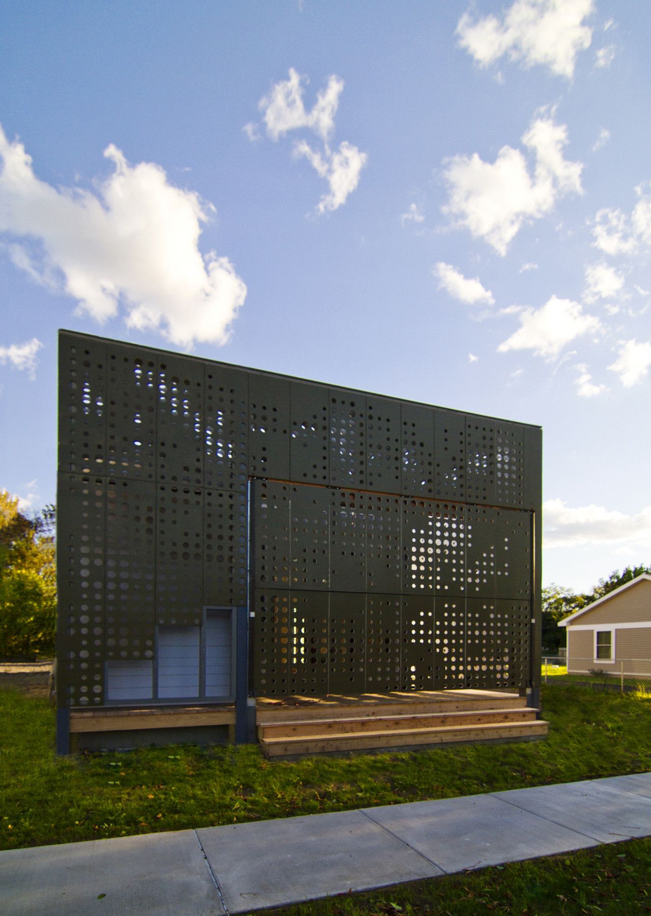 Live Work Home with a perforated Facade