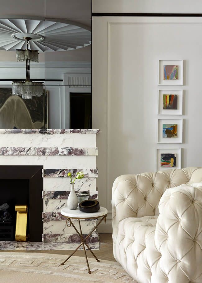 Living Room with Fireplace covered in white and gray marble
