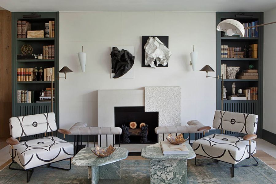 Living Room with white painted fireplace designed by Marta de la Rica