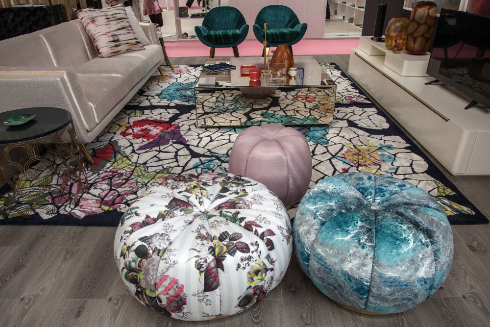 Living room design with a series of three round ottomans