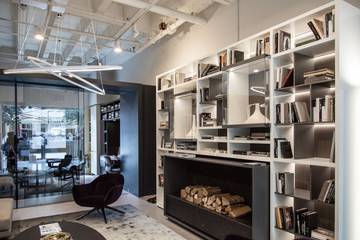 Living room wall library that wrap the fireplace