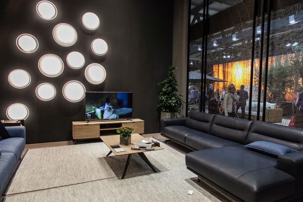 Living room with dark wall and modern lighting fixture