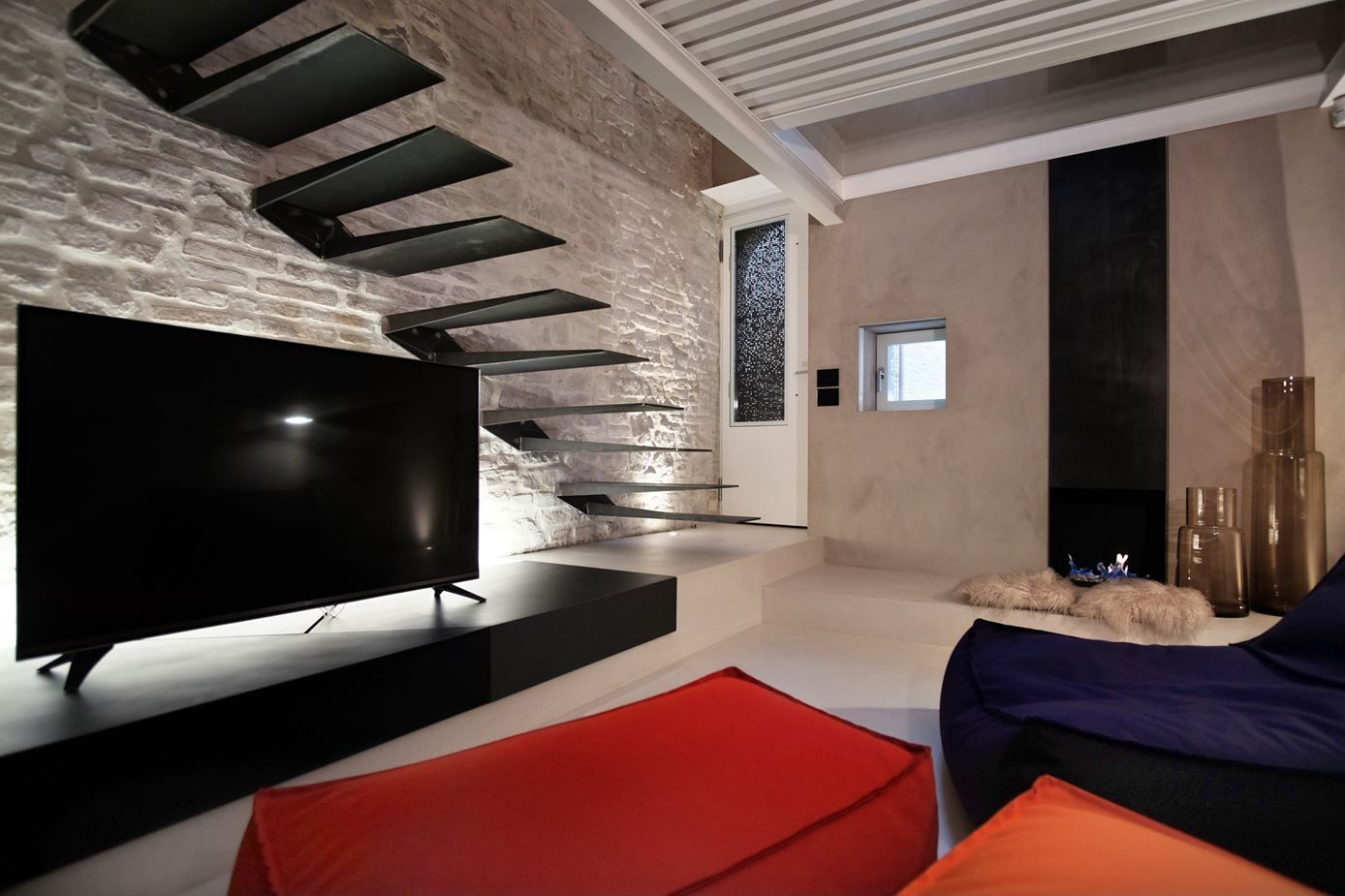 Living room with steel floating staircase