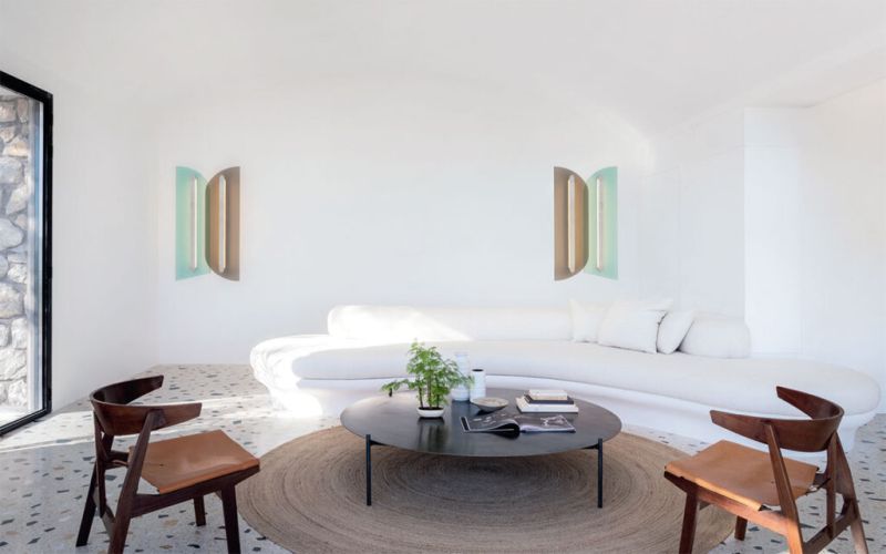 Living room with white wall and white sofa