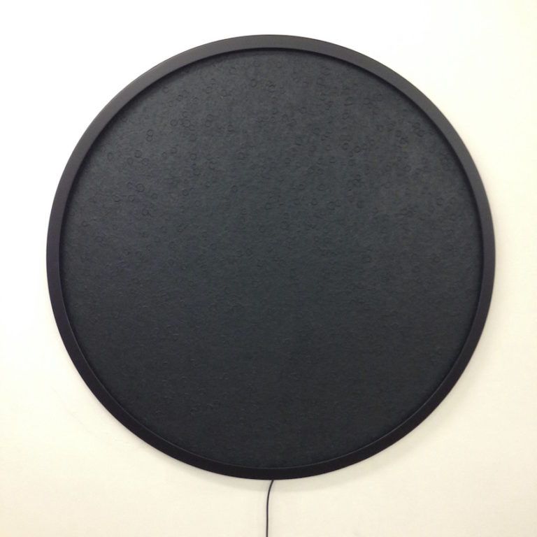 When unlit, the Luna looks like a dark, textured circle.