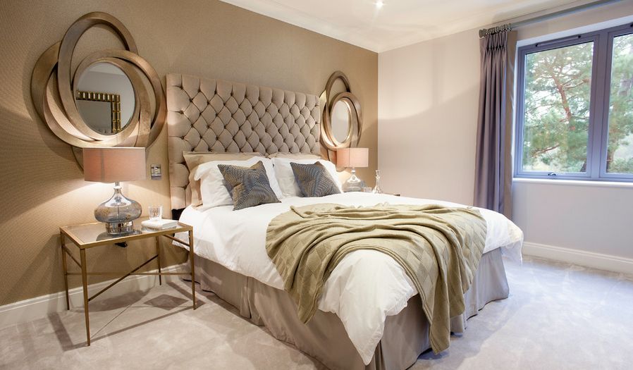 Luxury golden bedroom with tuftead headboard